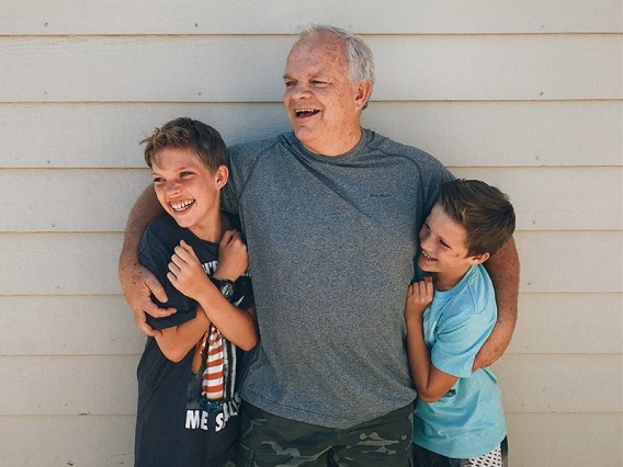 Happy grandfather with grandsons - Disability and Life Insurance