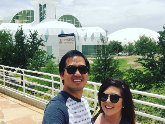 Smiling couple in front of Biosphere 2