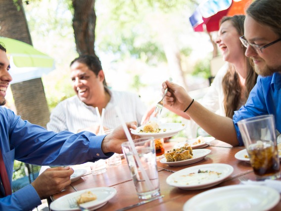 Smiling University of Arizona employees enjoying lunch