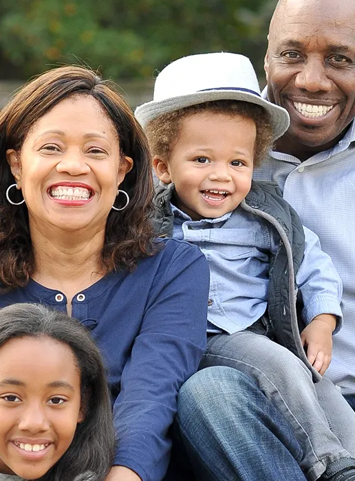Portrait of smiling family - compensation and benefits