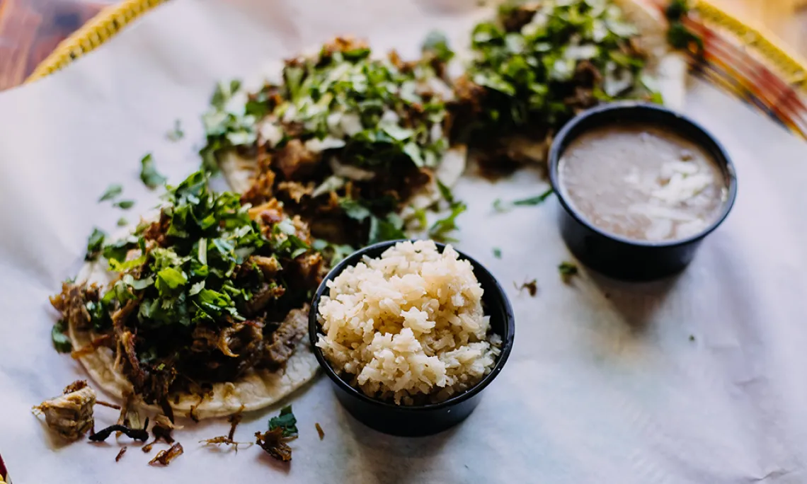 Colorful delicious looking tacos and rice